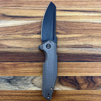 We Knife Starhawk 2.81" Flipping Knife w/ Black Blade & Bronze Titanium Handle
